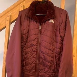 The North Face woman’s burgundy reversible winter jacket Medium.